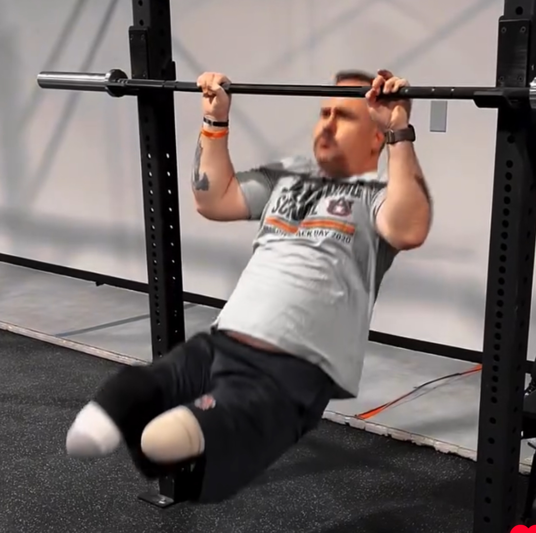 Image of Josh Wetzel doing a pull up for the Wetzel workout in the Iron Tribe gym.