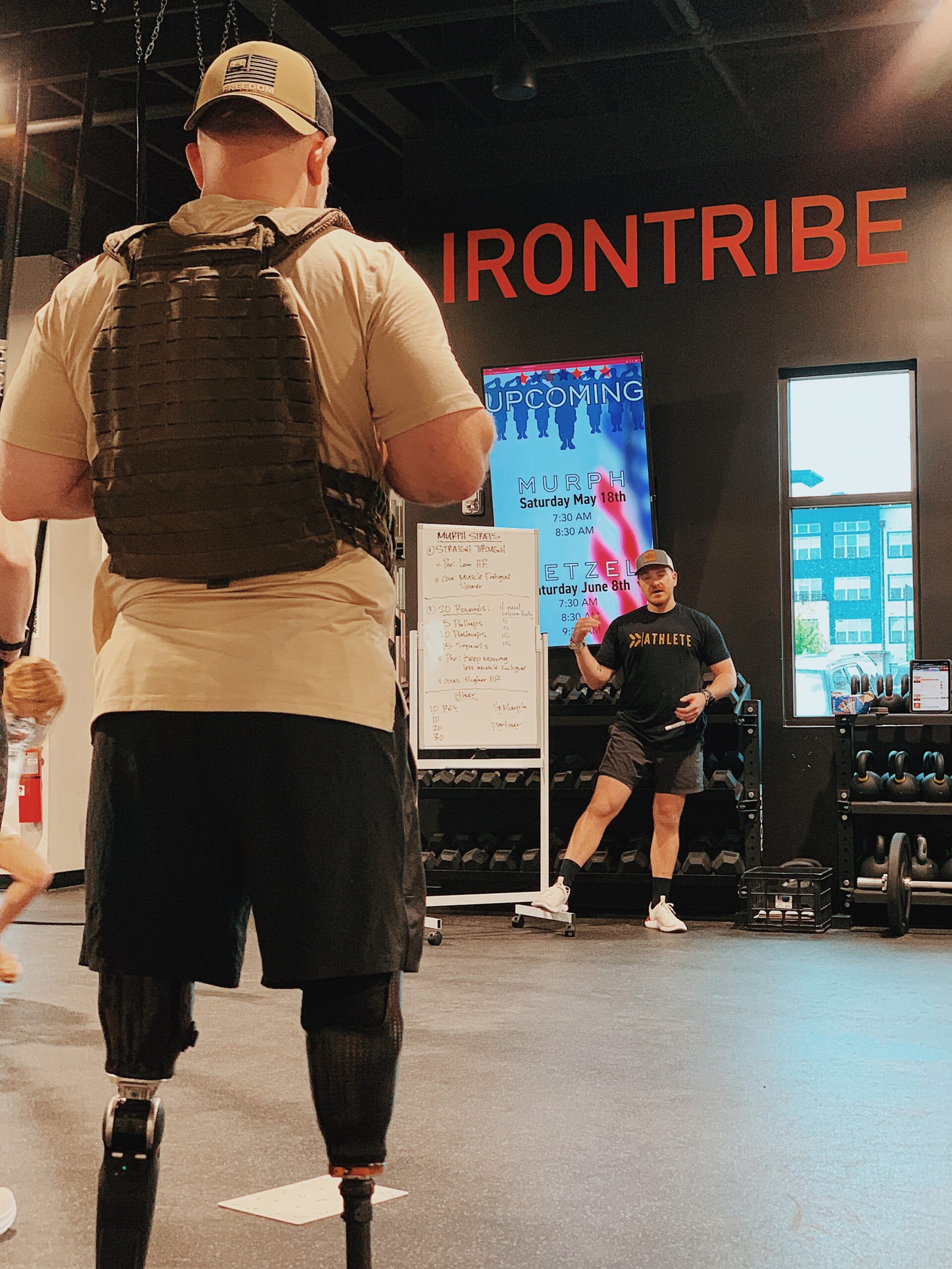 Image of Josh Wetzel learning what to do for the Wetzel workout in the Iron Tribe gym.