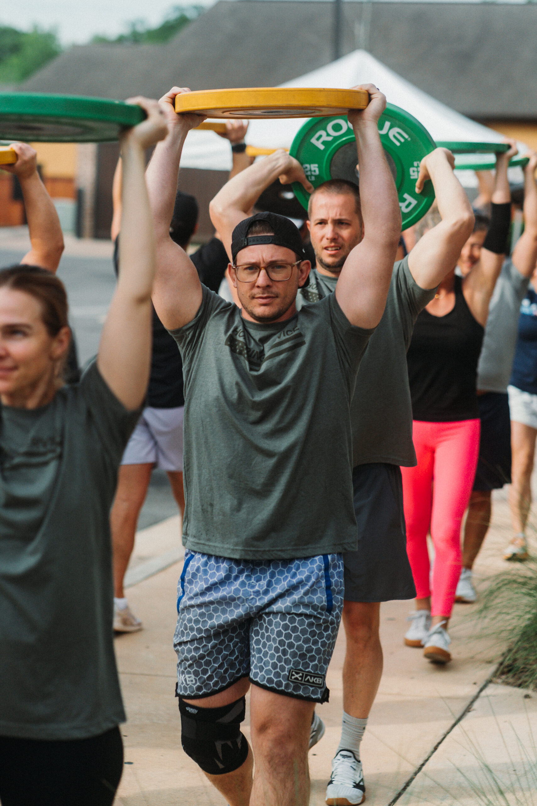 War Damn Wetzel participants supporting the veteran community by completing a 400M overhead plate carry
